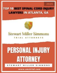 Stewart Miller Simmons Personal Injury Lawyers & Trial Attorneys | Atlanta, GA | Top 10 Best Spinal Cord Injury Lawyers in Atlanta, GA | Image of a digitally created magazine cover that says: "Top 10 Best Spinal Cord Injury Lawyers in Atlanta, GA" at the top. Stewart Miller Simmons Logo in the middle. "Personal Injury Attorney - Stewart Miller Simmons - www.smstrial.com" at the bottom - 2025